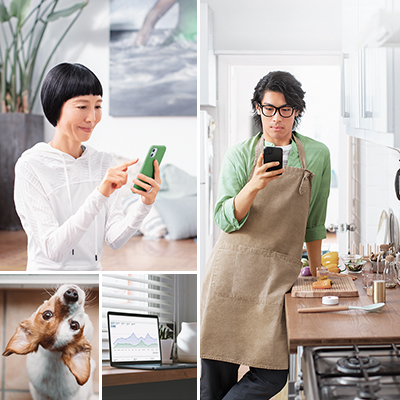 a woman and a man using their mobile, a dog and a laptop under them