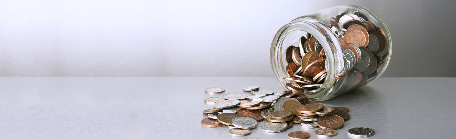 Spilling jar of coins