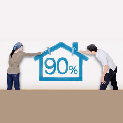 a couple painting a blue house with 90% in the house