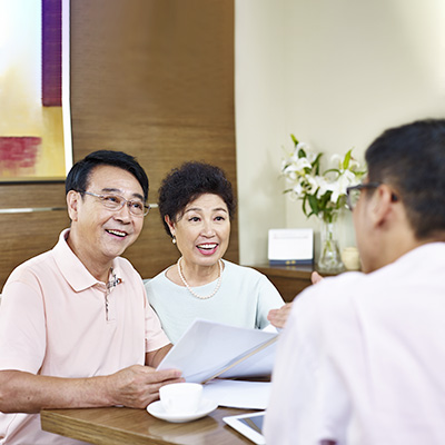 an old couple having a chat with a man in shirt
