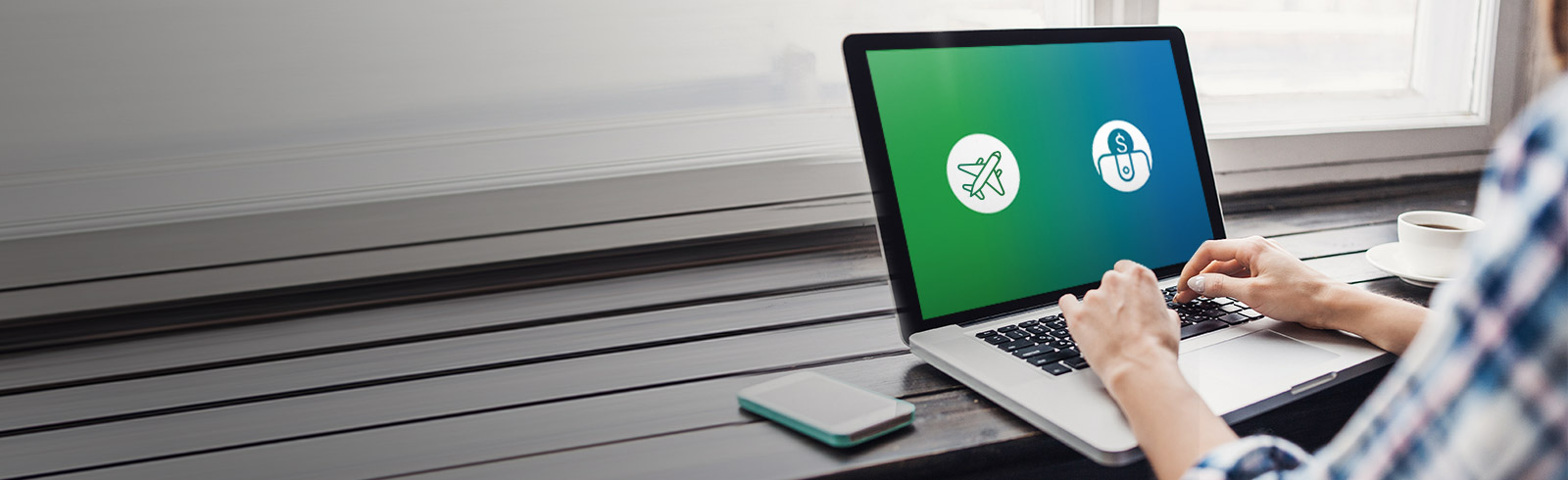 Using Laptop opening the airplane and dollar logos, used to promote Standard Chartered 360° Rewards Redemption Platform